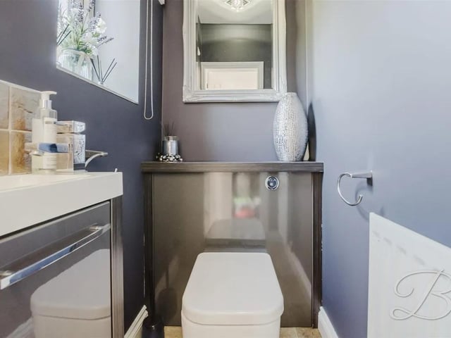 The downstairs WC is fitted with a hand wash basin, low flush WC and a window to the rear elevation.