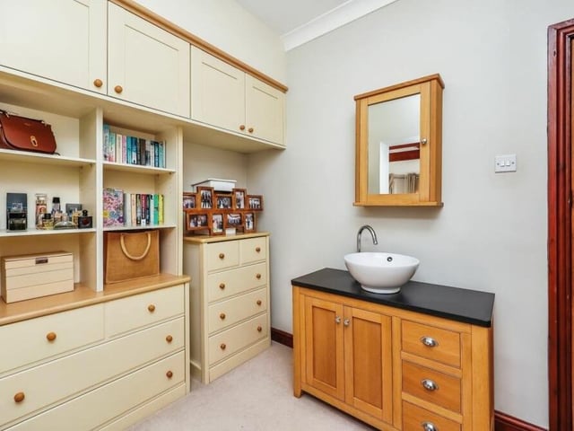 Attached to the master bedroom is this delightful dressing area.