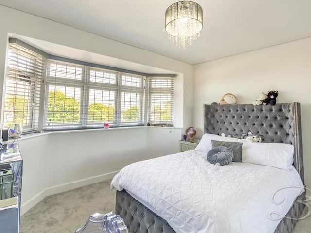 The second bedroom, which faces the front of the house, is also a comfortable space. Assets include a carpeted floor, TV point and fitted wardrobe.
