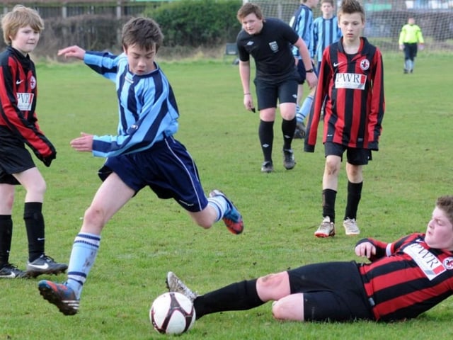 Mansfield Athletic (blue strip) and Manor Black in their U13's Division 2 match