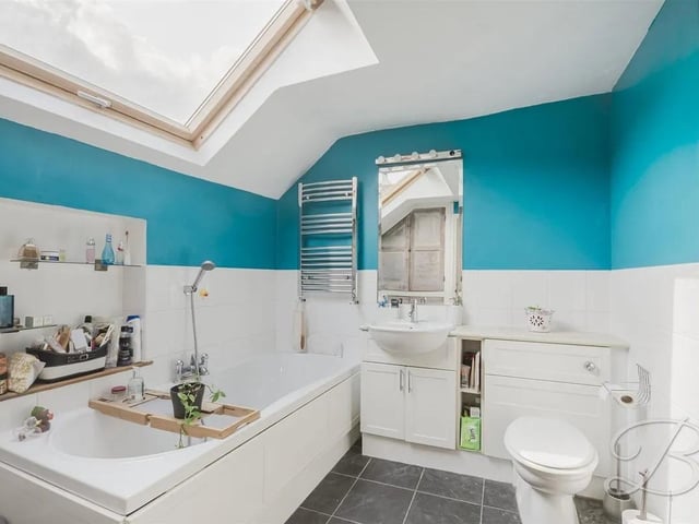 A three-piece family bathroom comprising a bath, hand wash basin, and low flush WC.