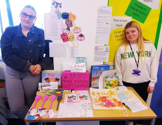 Millie Grace Allcock and Lily Yates with their chosen books and interactive resources
