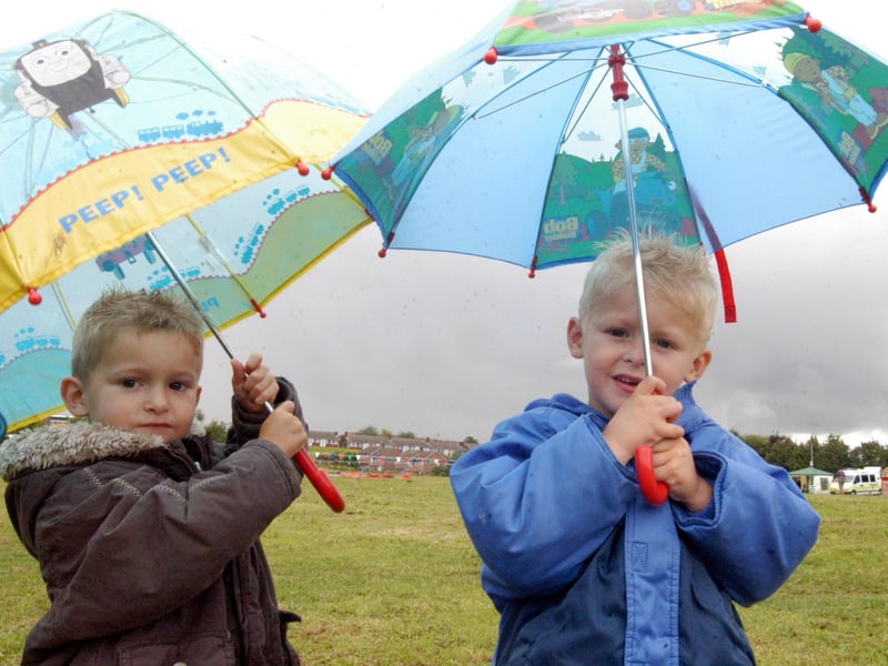 Youngsters Daniel Buckley and Cory Buckley from Langwith brave the rain to go to Shirebrook festival in 2007.