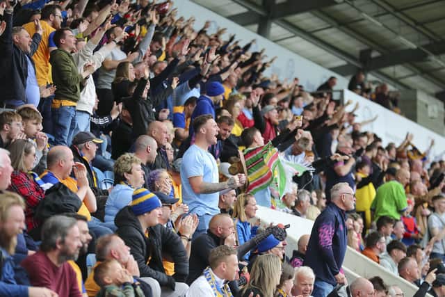 Mansfield Town fans get behind their side in Monday's win at Colchester United's JobServe Community Stadium. Photo by Chris & Jeanette Holloway/The Bigger Picture.media