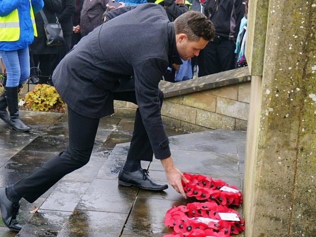Ben Bradley lays a wreath at the Mansfield Remembrance parade and service