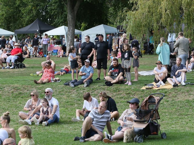 Crowds settle in for an outdoor film.