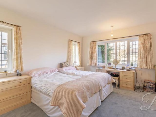 The first bedroom at the £560,000 house is bonny and bright, thanks largely to three windows to the side and front. Fitted carpets and fitted wardrobes add to the appeal of what is the largest of the five bedrooms.