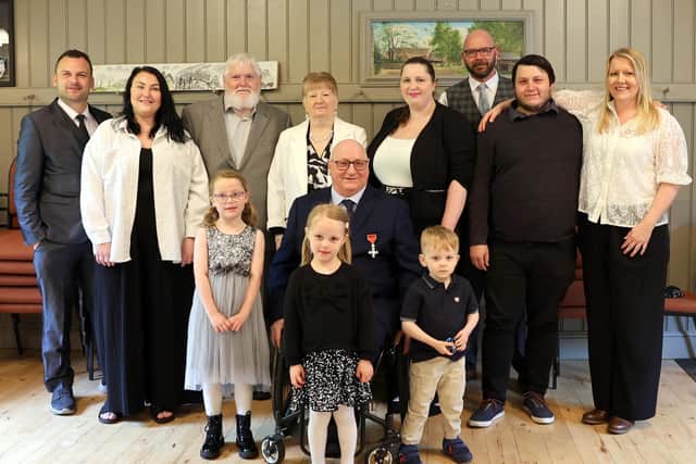 Peter, surrounded by family, friends, and civic dignitaries
