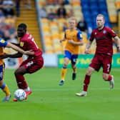 Mansfield Town forward Rhys Oates battles with Rochdale defender Jeriel Dorsett. Pic Chris Holloway / The Bigger Picture.media