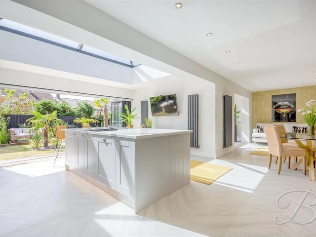 The open plan kitchen layout is designed perfectly for functional family living