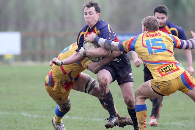 An Ashfield runner is halted by the Buxton defence.