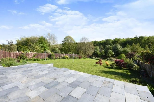 Let's step outside now and take a quick glance at the impressive back garden. It has been fully landscaped and has its own wildlife pond. A raised patio area is also ideal for entertaining family and friends during the summer.