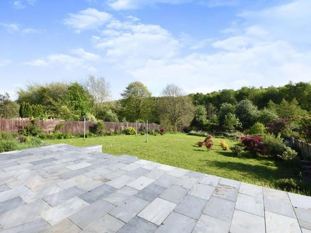 Let's step outside now and take a quick glance at the impressive back garden. It has been fully landscaped and has its own wildlife pond. A raised patio area is also ideal for entertaining family and friends during the summer.
