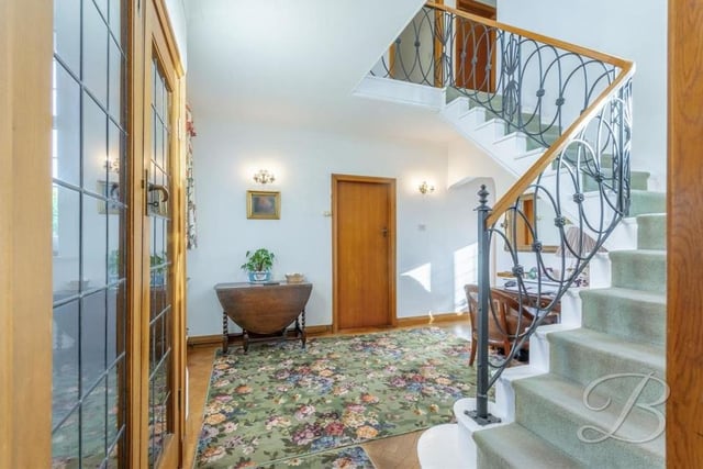 As you step inside the Forest Hill property, you are greeted by this stunning entrance hall, with its winding staircase and spacious storage cupboard and cloakroom.