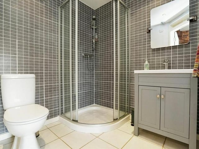 Whatever the mezzanine bedroom is used for, it has access to this attractive en suite shower room.
