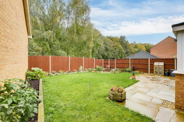The back garden is private and enclosed by fence panelling. There is also a shed, an outdoor tap and decorative ambient lighting.