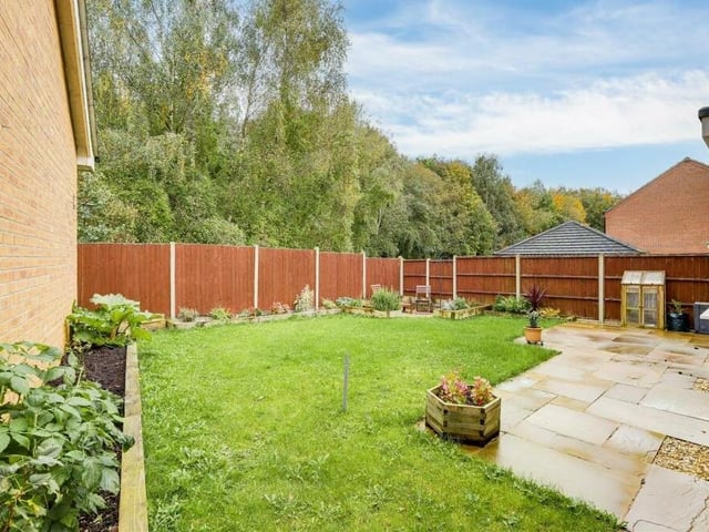 The back garden is private and enclosed by fence panelling. There is also a shed, an outdoor tap and decorative ambient lighting.