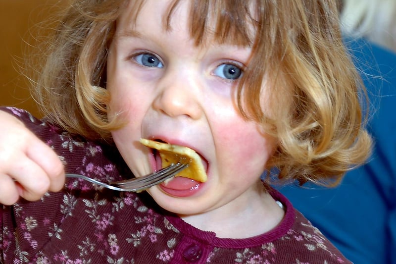 Charlotte Thompson, aged three, tucked into a pancake at the Methodist Church Hall in Tickhill  in 2010. The event was organised to raise money for the Doncaster Live at Home scheme.