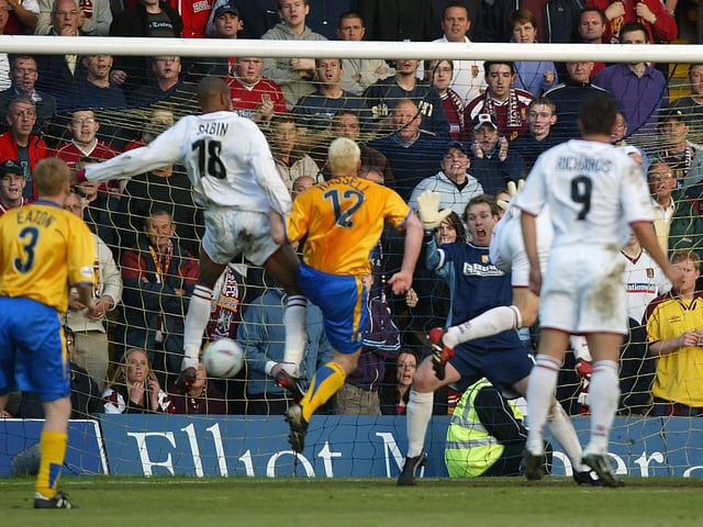 Eric Sabin scores Northampton's second goal to leave it finally poised at 2-2 on aggregate.
