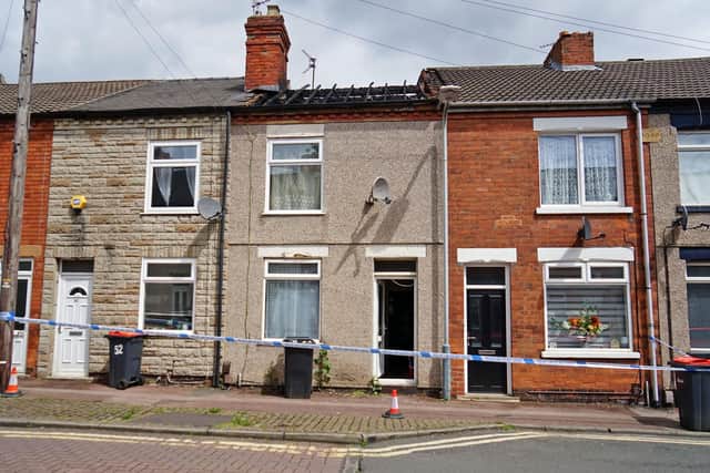 Crime scene tape outside the fire-hit property.