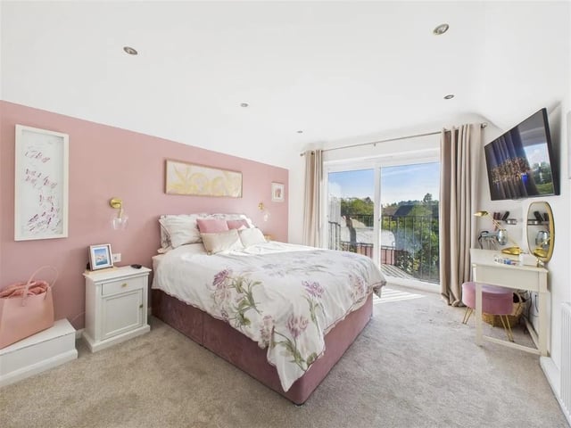 A beautifully presented and decorated bedroom with feature patio doors with Juliet balcony giving lovely views over Ravenshead. The bedroom is accessed through a private dressing room, which sits alongside a stunning en-suite bathroom.