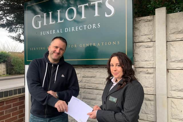 Chris Tomlinson, centre manager at The Tin Hat Centre in Selston receives a donation from Danni Allen, of Gillotts.