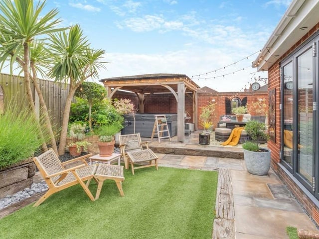 Are we in Sutton or Barbados? It could be either as you lounge around in this sunny seating area, just beyond the bi-folding doors that lead from the open-plan extension.