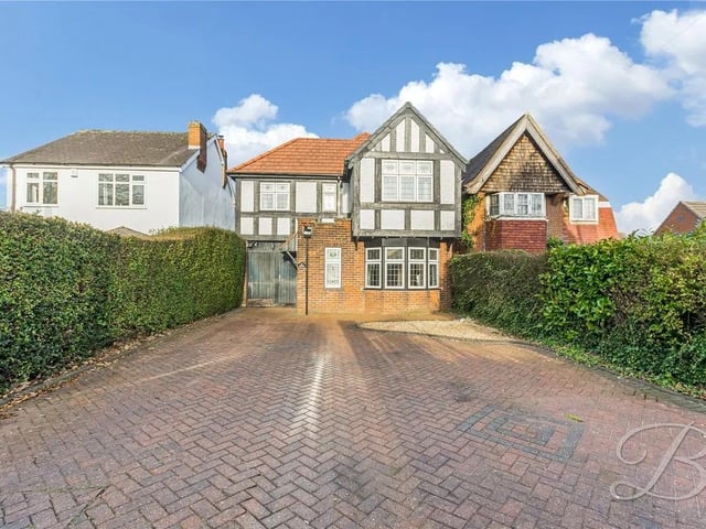 To the front of the property is a private driveway and garage, allowing space for both off-road parking and secure storage.