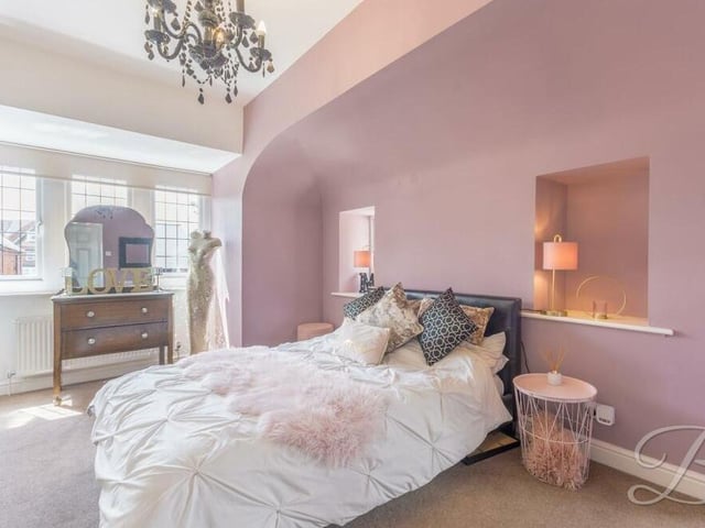 This fourth bedroom is a delightful space. Its bay window faces the front of the house.