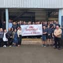 Staff at Imperial Laundry, Mansfield, celebrating the local business turning 120-years-old