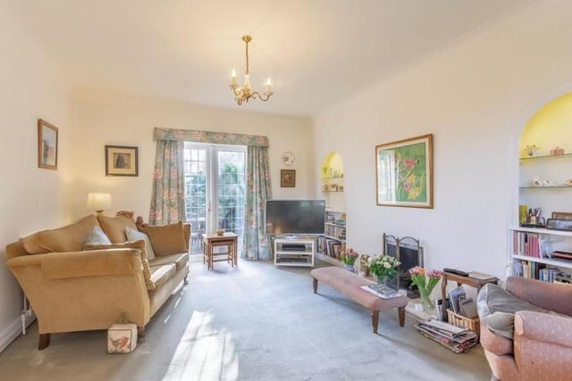 The beautiful lounge is the first of the ground-floor rooms we take a look at. Very spacious, it boasts fitted carpets and French doors leading out to the back garden.