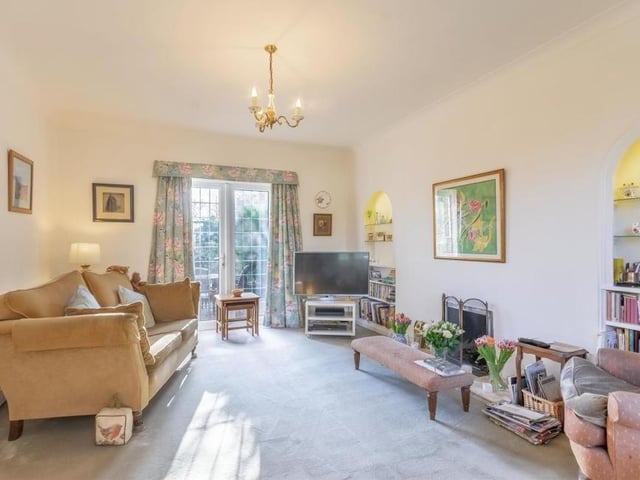 The beautiful lounge is the first of the ground-floor rooms we take a look at. Very spacious, it boasts fitted carpets and French doors leading out to the back garden.