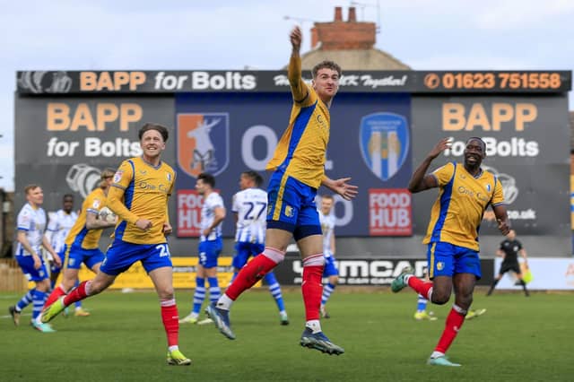 Lewis Brunt levels the scores during the Sky Bet League 2 match against Colchester Utd at the One Call Stadium, 23 March 2024, Photo credit Chris & Jeanette Holloway / The Bigger Picture.media