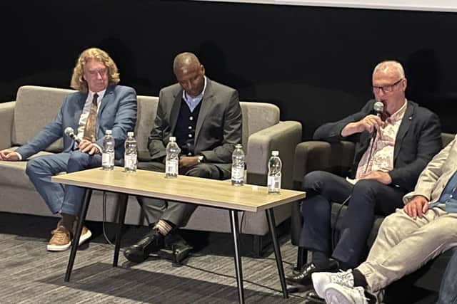 From left, Tony Woodcock, Viv Anderson and Garry Birtles speak to the audience at the premiere of their new film, Local Heroes.