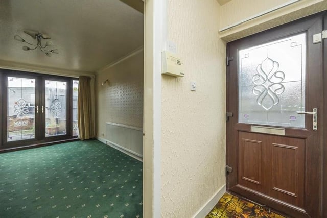 The entrance hallway, with its carpeted floor and access to the loft, greets you as you go into the Thorpe Road bungalow. The first room you come to is the lounge or living room on your right-hand side.