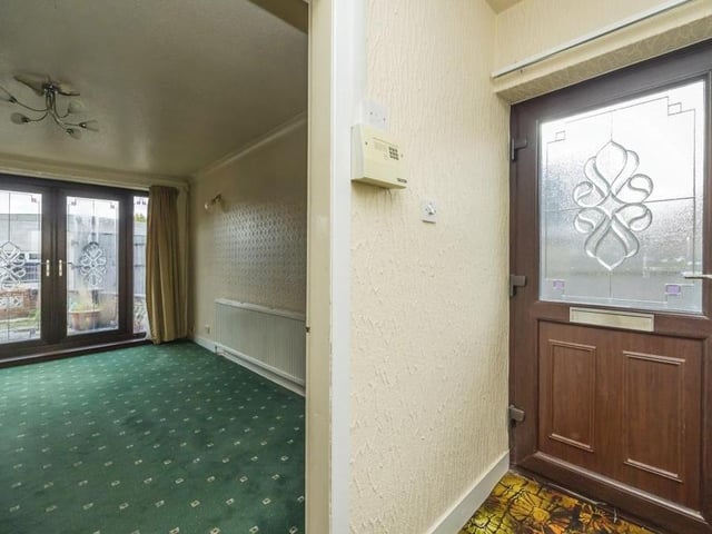 The entrance hallway, with its carpeted floor and access to the loft, greets you as you go into the Thorpe Road bungalow. The first room you come to is the lounge or living room on your right-hand side.