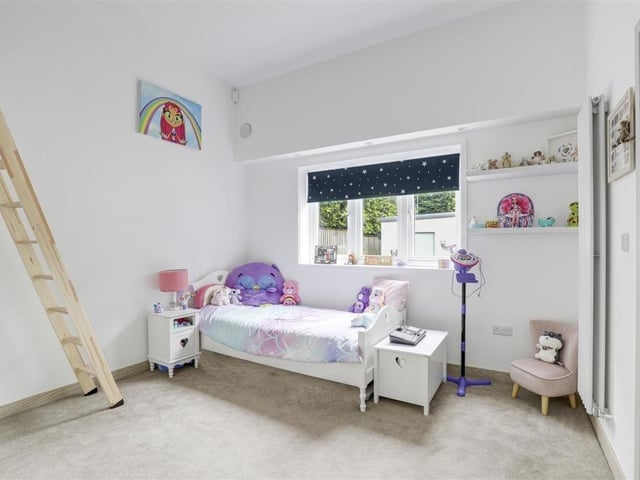 The bright and cheerful second bedroom from a different angle. The uPVC double-glazed window overlooks the front of the £750,000 property.
