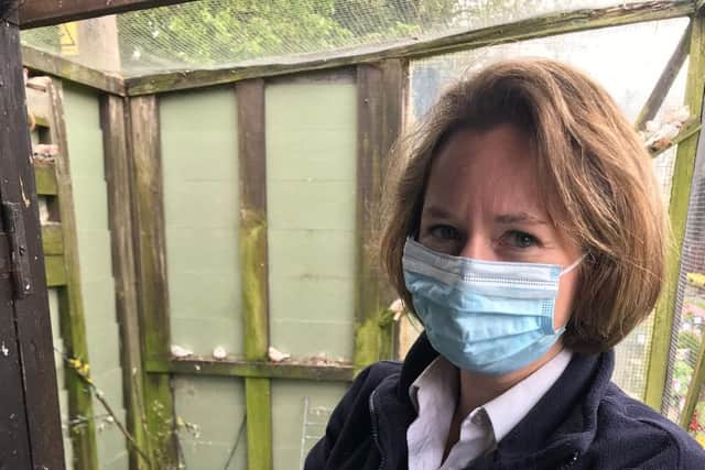 RSPCA officer Emily with one of the finches