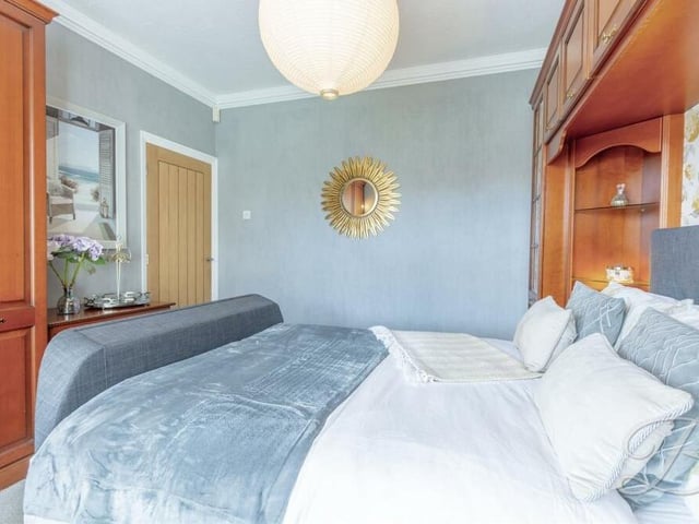 The main bedroom, which faces the front of the property, has the added benefit of two built-in wardrobes.