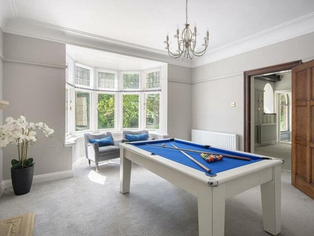 This is a versatile space that could be used either as a games room or as a dining room. It boasts a large bay window, overlooking the front of the house, and a feature fireplace. An ideal spot for entertaining guests.