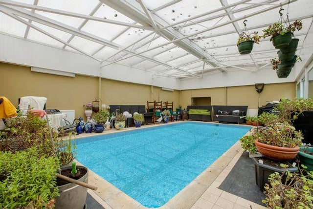 The swimming pool is accessed off the conservatory at the rear of this home on Saltcotes Road, Lytham.