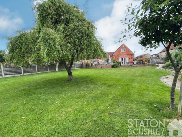 The historic property at Nettleworth Manor sits on a fantastic-sized plot that contains a well-maintained and established garden, with lawns and trees.