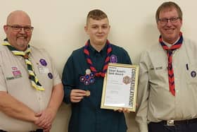 Liam Wilkinson receives his award from Pete Hawley, Mansfield Scouts district commissioner, left, and Andrew Melless, 2nd Warsop Group Scout Leader.