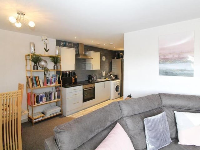 As you can see, there is plenty of room by the kitchen for a dining area, with table and chairs.