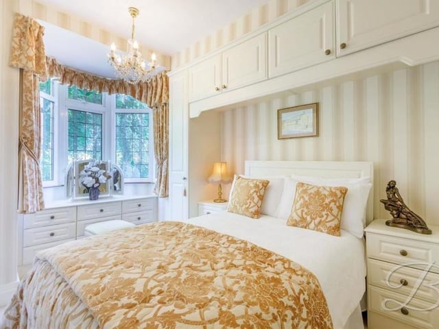 The first of three bedrooms to look at on the first floor of the £575,000 property is this one, complete with carpeted flooring and fitted wardrobes. It faces the side of the house.