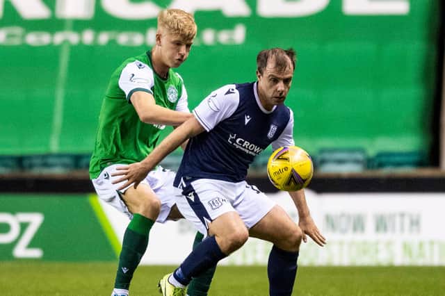 Josh Doig keeps a close eye on Dundee's Paul McGowan