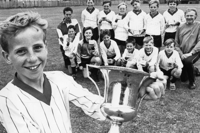 Captain Stewart Williamson and the South Shields Primary School football team with the Derwent and Medomsley Cup. The team beat Kelloe 6-1 in the final of the under 11 competition held in South Shields. Does this bring back happy memories?
