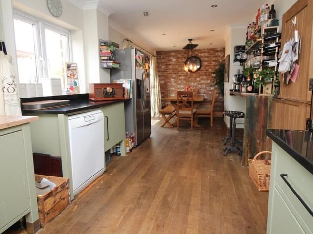 The kitchen features all you need, including plumbing and wiring for an American-style fridge/freezer, plumbing for a dishwasher, a radiator and ceiling spotlights. At one end is the dining area.
