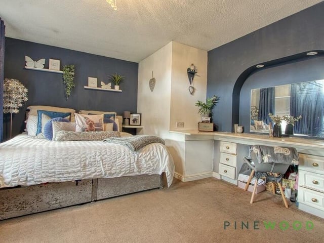 The biggest of the four bedrooms is this expansive master, which includes a wonderful dressing table, integrated wardrobes and a fitted carpet.