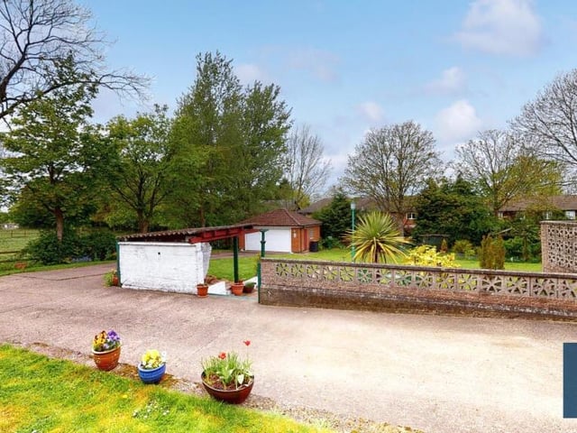 Off-street parking space is provided by this good-sized, private driveway at the front of the Selston bungalow. In the background, you can see a sturdy double garage.